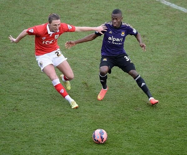 Intense Moment: Luke Ayling and Enner Valencia Battle for Possession during Bristol City vs. West Ham United, FA Cup Fourth Round