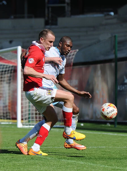 Intense Moment: Wilbraham Fights Off Johnson's Pressure during Bristol City vs Coventry City Football Match, 2015