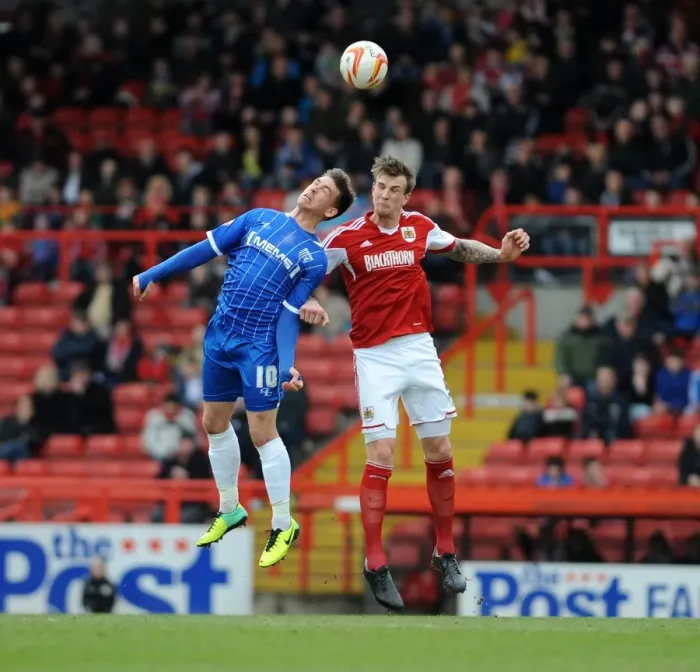 Framed Print : Intense Rivalry: Aden Flint vs. Cody McDonald - Bristol City vs. Gillingham, Sky Bet League One, 2014