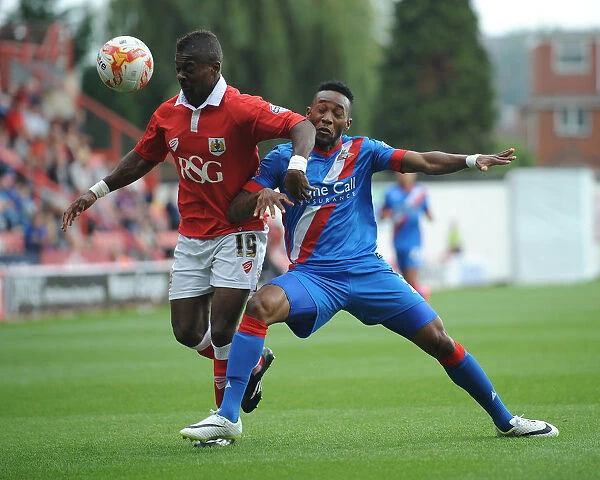Intense Rivalry: Agard and Bennett Clash in Bristol City vs Doncaster Rovers Football Match, September 2014