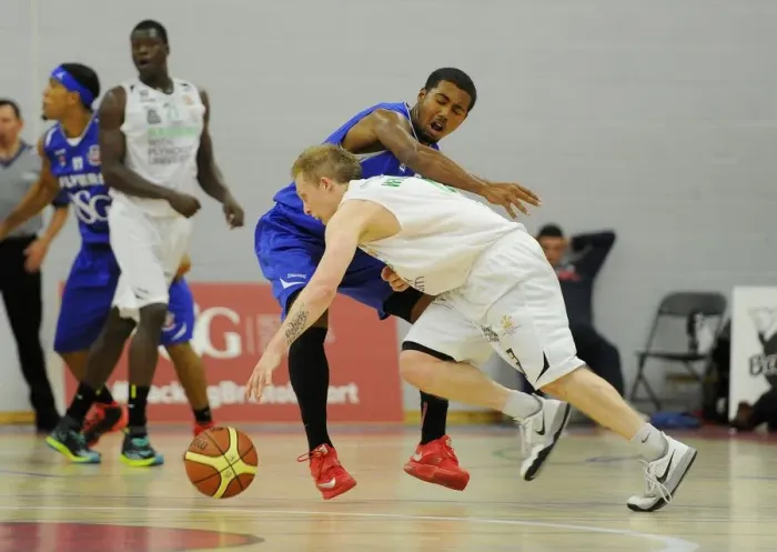 Framed Print : Intense Rivalry on the Basketball Court: Flyers vs. Raiders at SGS Wise Campus, September 2014