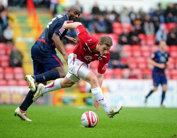 Intense Rivalry: A Battle of Wits - Ribeiro vs. Adebola in the Championship Clash between Bristol City and Nottingham Forest, April 2010