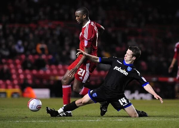 Intense Rivalry: Cisse vs. Hogg in the Championship Clash between Bristol City and Portsmouth - 8th March 2011