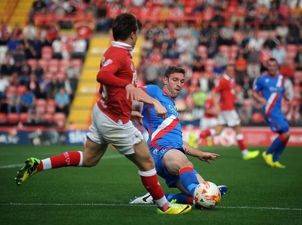 Intense Rivalry: A Clash Between Luke Freeman and Jamie McCombe in Bristol City vs. Doncaster Rovers Football Match