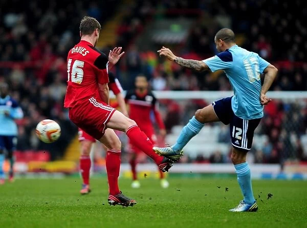 Intense Rivalry: Davies vs. Dyer - A Battle for Possession in Bristol City vs. Middlesbrough