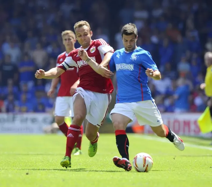 Framed Print : Intense Rivalry on the Field: Liam Kelly vs. Richard Foster Clash at Ashton Gate