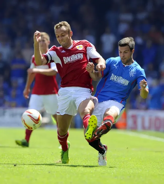Framed Print : Intense Rivalry on the Field: Liam Kelly vs. Richard Foster - Bristol City vs. Glasgow Rangers