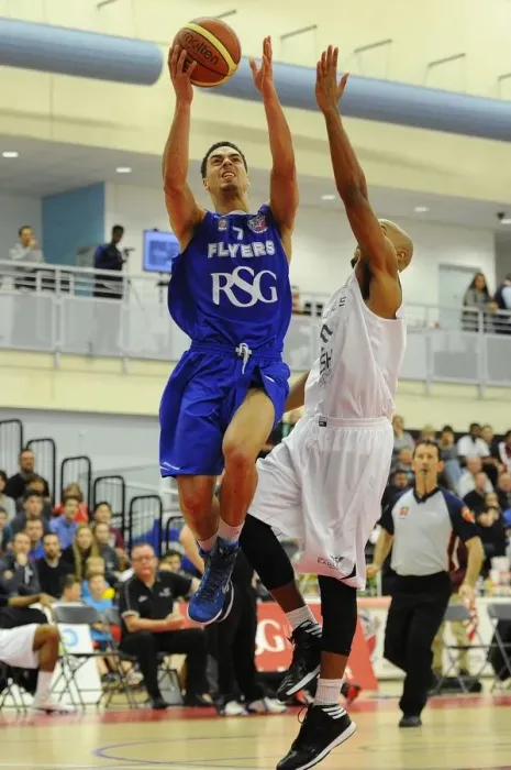 Framed Print : Intense Rivalry: Flyers vs. Eagles Basketball Showdown at SGS Wise Campus (November 2014)