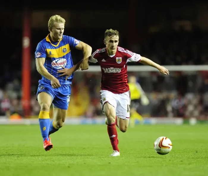 Framed Print : Intense Rivalry: Joe Bryan vs Curtis Main Clash in Sky Bet League One: Bristol City vs Shrewsbury Town