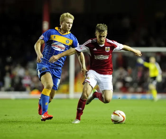 Framed Print : Intense Rivalry: Joe Bryan vs Curtis Main - Sky Bet League One Clash at Ashton Gate Framed Print : Intense Rivalry: Joe Bryan vs Curtis Main - Sky Bet League One Clash at Ashton Gate
