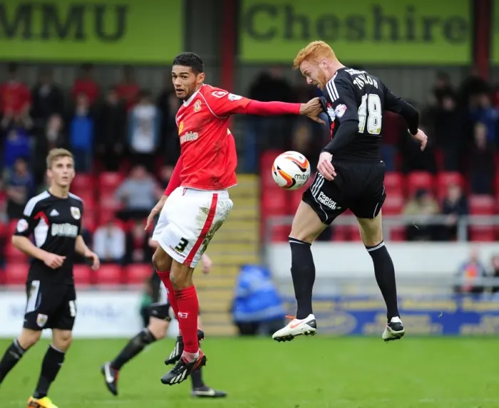 Framed Print : Intense Rivalry: A Leap for Supremacy - Mellor vs. Taylor in Crewe vs. Bristol City Football Match