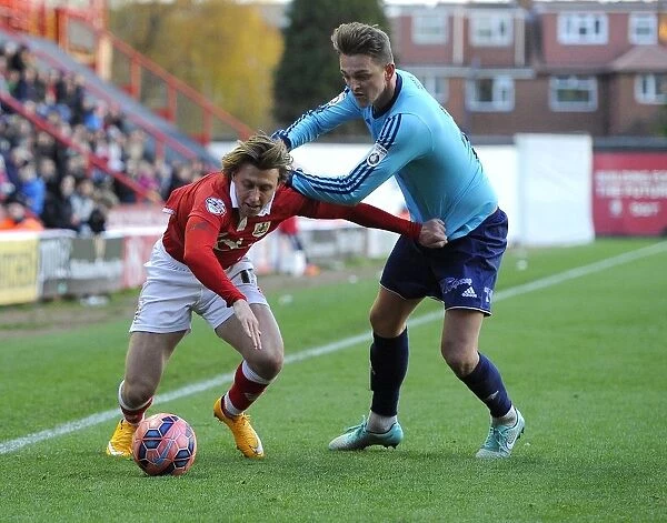 Intense Rivalry: Luke Freeman Protects His Shirt from Kristian Platt during Bristol City vs AFC Telford United FA Cup Match