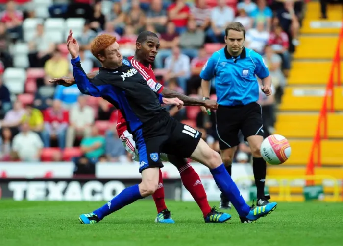 Framed Print : Intense Rivalry: Marvin Elliott vs Dave Kitson - The Championship Showdown at Ashton Gate Stadium (Bristol City vs Portsmouth)