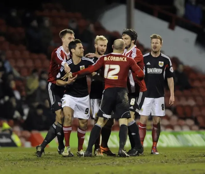 Framed Print : Intense Rivalry: McCormack vs. Elliott Clash at Brentford - Football's Fiery Moment between Wade Elliott and Alan McCormack Framed Print : Intense Rivalry: McCormack vs. Elliott Clash at Brentford - Football's Fiery Moment between Wade Elliott and Alan McCormack