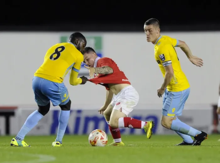 Framed Print : Intense Rivalry: Monelle vs. Boateng Clash in Bristol City U21s vs Crystal Palace U21s Football Match