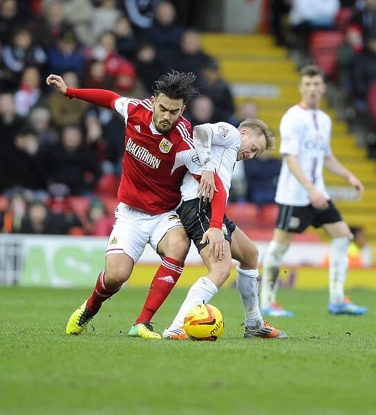 Intense Rivalry: Pack vs. Reeves - A Battle for Possession in Sky Bet League One's Bristol City vs. MK Dons Match, Ashton Gate