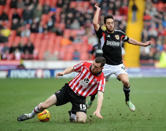 Framed Print : Intense Rivalry: Sam Baldock vs. Neil Collins - A Football Showdown in Sky Bet League One (February 2014)