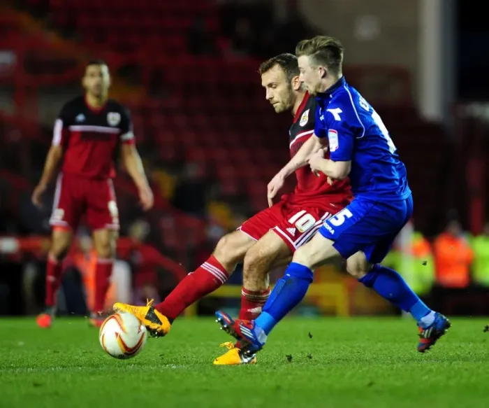 Framed Print : Intense Rivalry: Wade Elliott Chases Down Liam Kelly in Bristol City vs Birmingham City Football Match