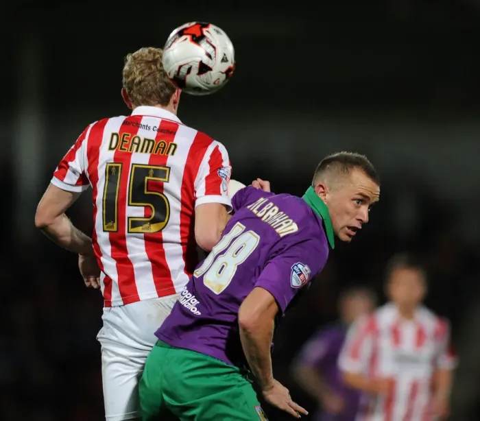 Framed Print : Intense Rivalry: Wilbraham vs Deaman - The Battle for the Ball in Cheltenham Town vs Bristol City Football Match, October 2014