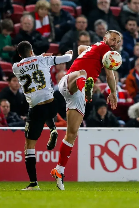 Framed Print : Intense Rivalry: Wilbraham vs. Olsson Clash at Ashton Gate
