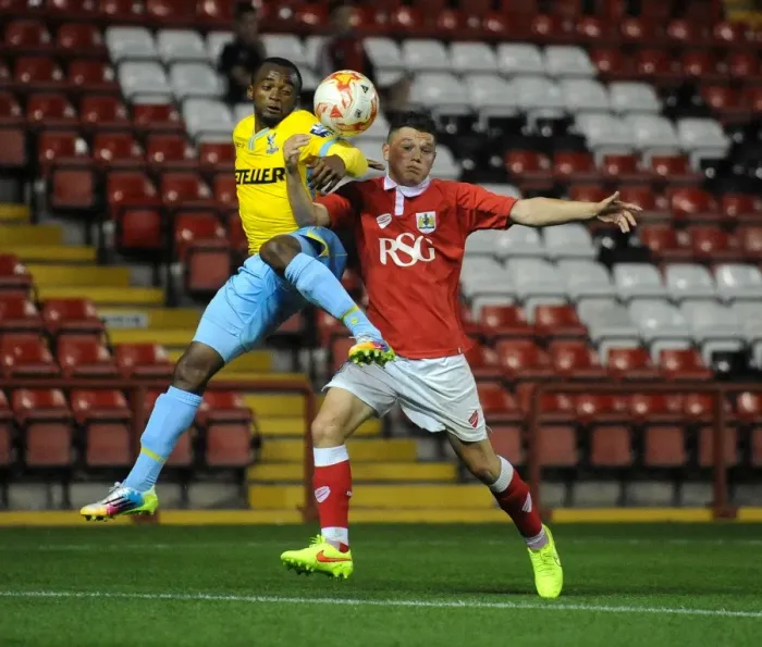 Framed Print : Intense Rivalry: Young Footballers Battle for Ball Possession - Bristol City U21s vs Crystal Palace U21s