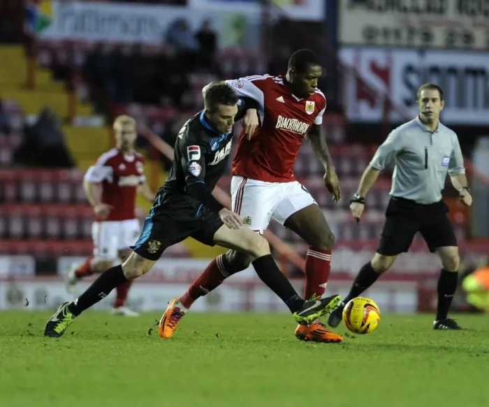Framed Print : Intense Sky Bet League One Clash: Jay Emmanuel-Thomas Tackled by Opponent at Ashton Gate Framed Print : Intense Sky Bet League One Clash: Jay Emmanuel-Thomas Tackled by Opponent at Ashton Gate