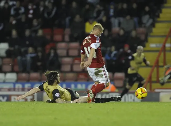 Framed Print : Intense Sky Bet League One Clash: Simon Gillett Tackled by Leyton Orient Player Framed Print : Intense Sky Bet League One Clash: Simon Gillett Tackled by Leyton Orient Player