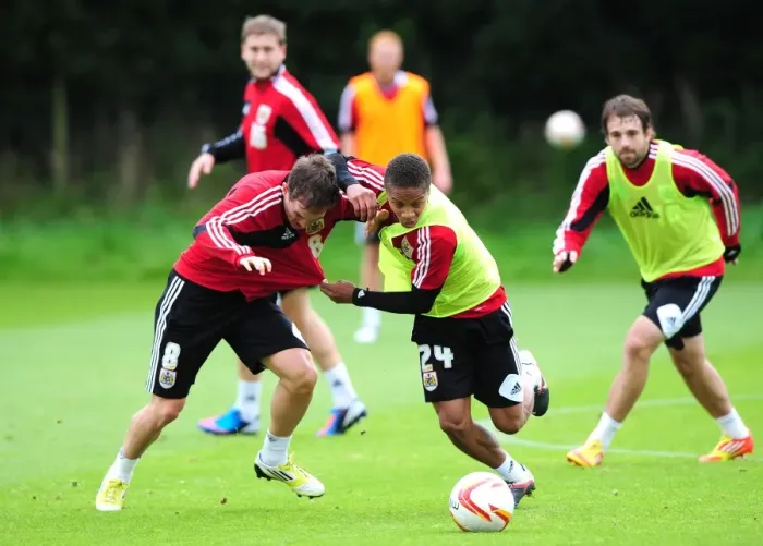 Framed Print : Intense Training: Bobby Reid vs Neil Kilkenny - A Battle for the Ball at Bristol City Football Club