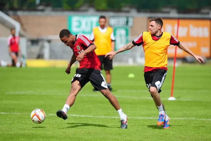 Framed Print : Intense Training Clash: Bobby Reid vs. Paul Anderson, Bristol City Football Club