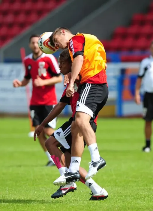 Framed Print : Intense Training Showdown: Bobby Reid vs Joe Edwards, Bristol City Football Club Framed Print : Intense Training Showdown: Bobby Reid vs Joe Edwards, Bristol City Football Club