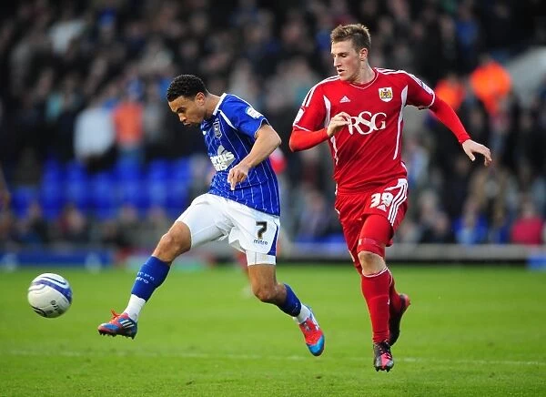 Ipswich Town's Carlos Edwards Outmuscles Bristol City's Chris Wood in March 2012 Clash at Portman Road