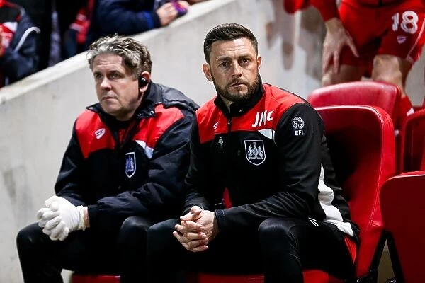 Jamie McAllister Watches Intently as Bristol City Takes on Huddersfield Town