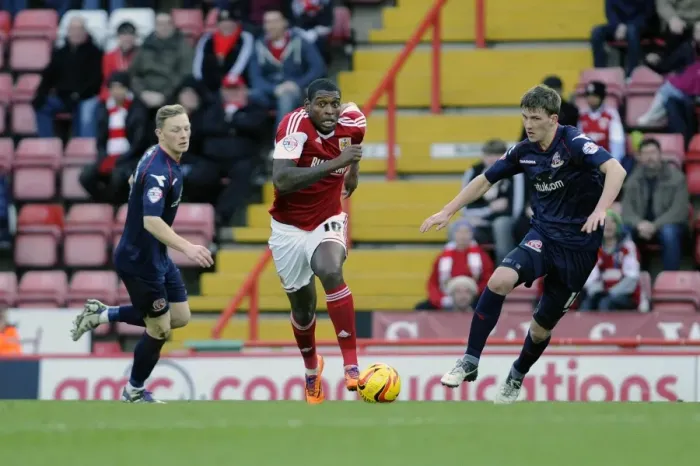 Framed Print : Jay Emmanuel-Thomas Dashes Past Defenders in Bristol City's Victory over Walsall