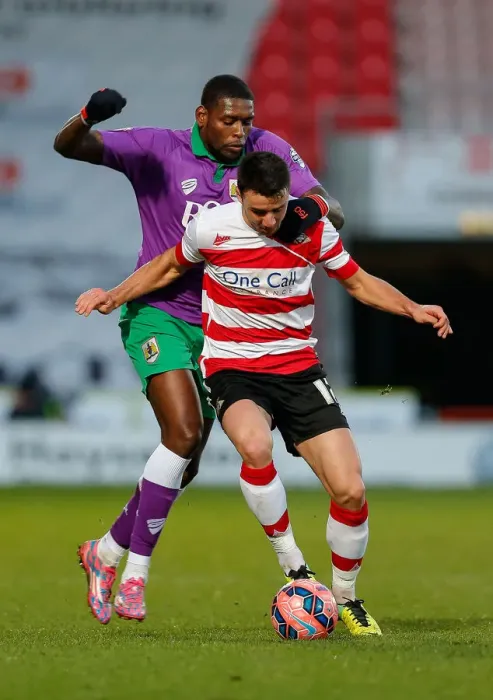 Framed Print : Jay Emmanuel-Thomas Dispossessed by Enda Stevens in Doncaster Rovers vs. Bristol City FA Cup Clash Framed Print : Jay Emmanuel-Thomas Dispossessed by Enda Stevens in Doncaster Rovers vs. Bristol City FA Cup Clash
