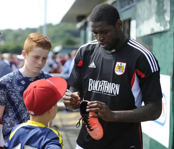 Framed Print : Jay Emmanuel-Thomas Signs Boot at Portishead Town's The Playing Fields During Pre-Season Friendly Against Bristol City Framed Print : Jay Emmanuel-Thomas Signs Boot at Portishead Town's The Playing Fields During Pre-Season Friendly Against Bristol City