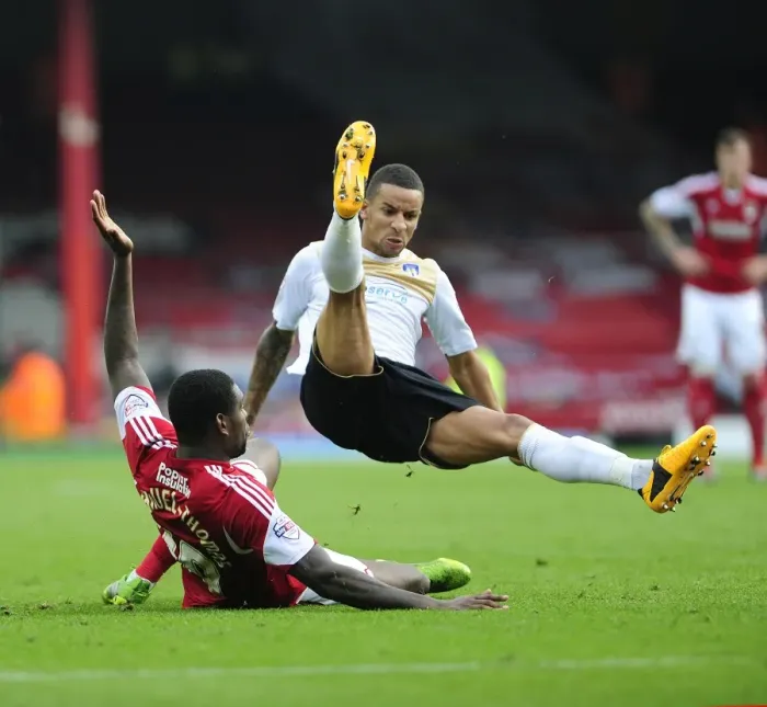 Framed Print : Jay Emmanuel-Thomas Tackles Craig Eastmond in Intense Football Action - Bristol City vs Colchester United