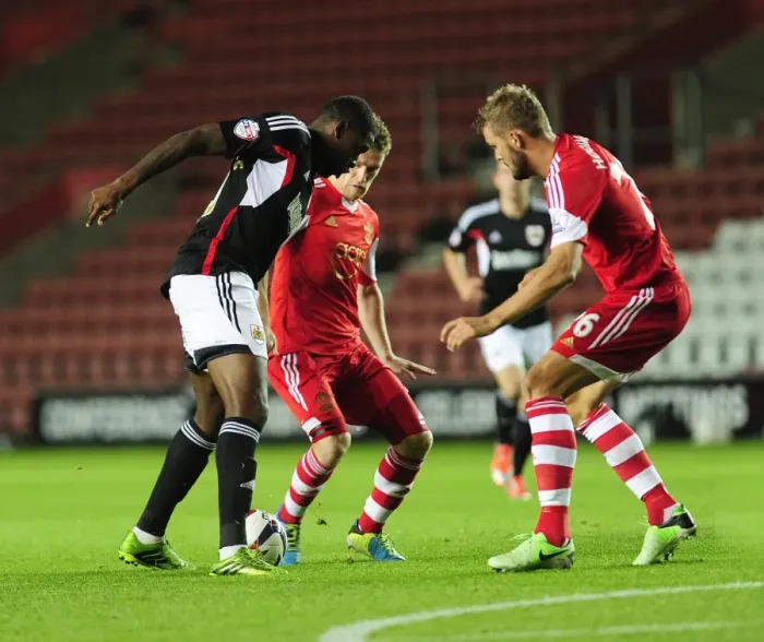 Framed Print : Jay Emmanuel-Thomas Tries to Beat Southampton's Defense - Football Rivalry at St Mary's Stadium, 2013