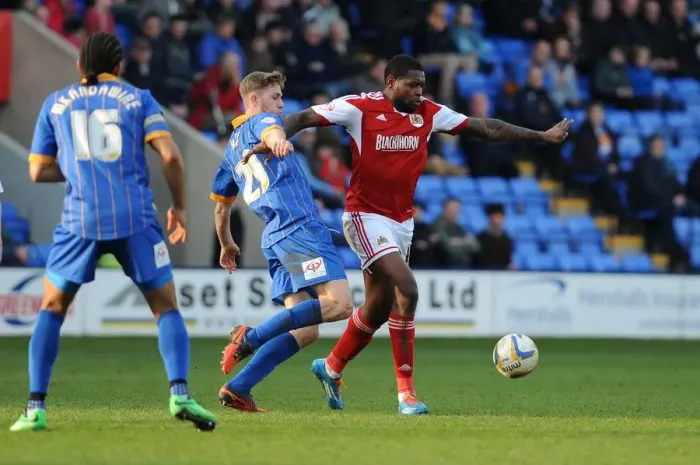 Framed Print : Jay Emmanuel-Thomas vs Asa Hall: Intense Battle in Shrewsbury Town vs Bristol City Football Match, Sky Bet League One