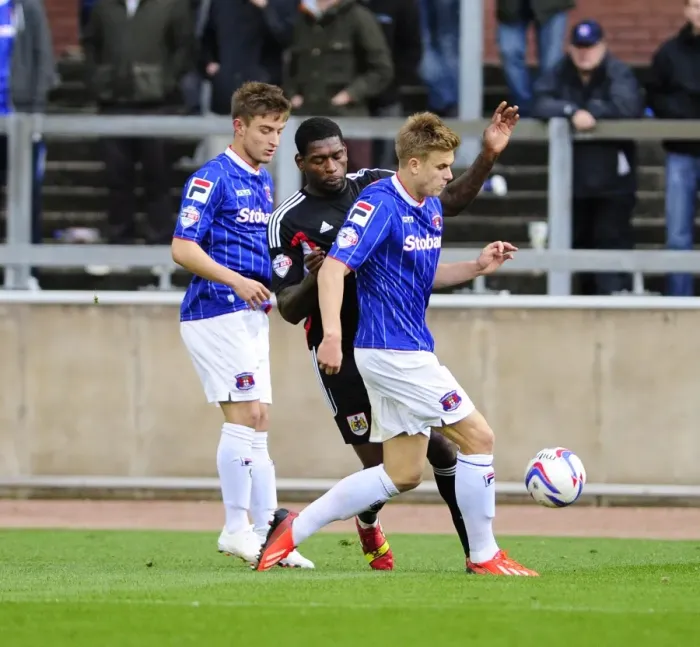 Framed Print : Jay Emmanuel-Thomas vs Brad Potts: Intense Moment in Carlisle United vs Bristol City Football Match, October 2013