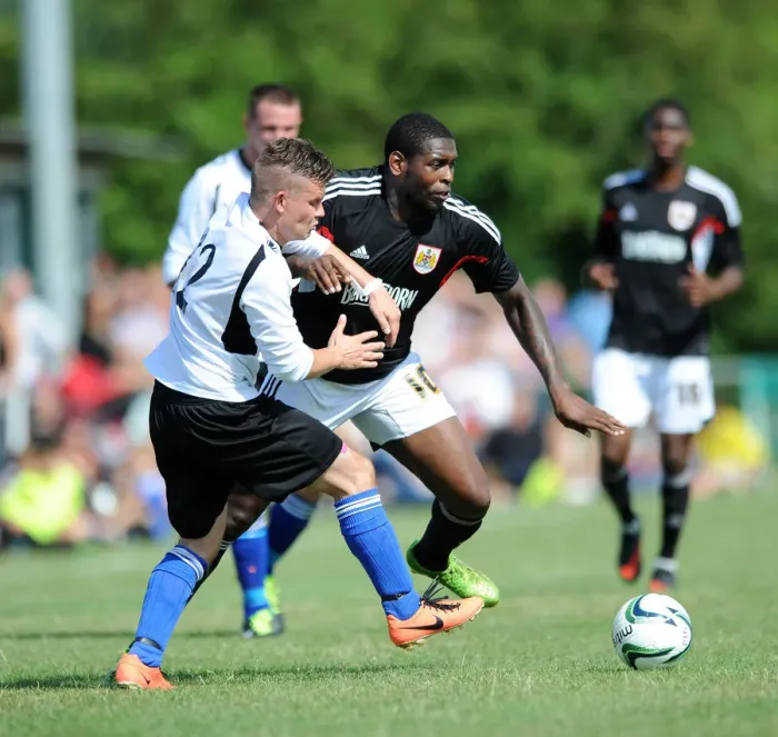Framed Print : Jay Emmanuel-Thomas vs James Hughes: Intense Moment from Portishead Town vs Bristol City Pre-Season Friendly
