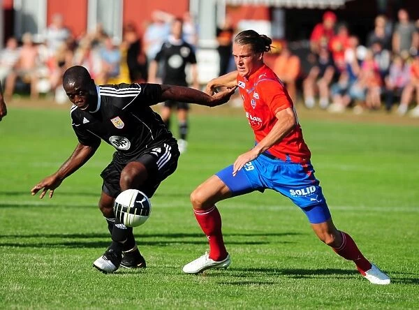 John Akinde Fights for Possession: Helsingborgs IF vs. Bristol City