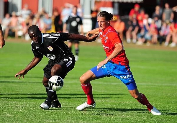 John Akinde's Determined Fight for Possession: Helsingborgs IF vs. Bristol City