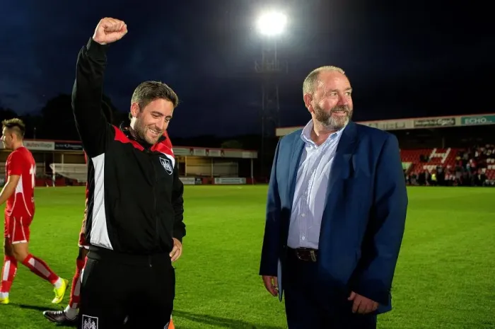 Framed Print : Johnson vs. Johnson: Lee Celebrates Victory Over Father Gary After Bristol City's Win Against Cheltenham Town