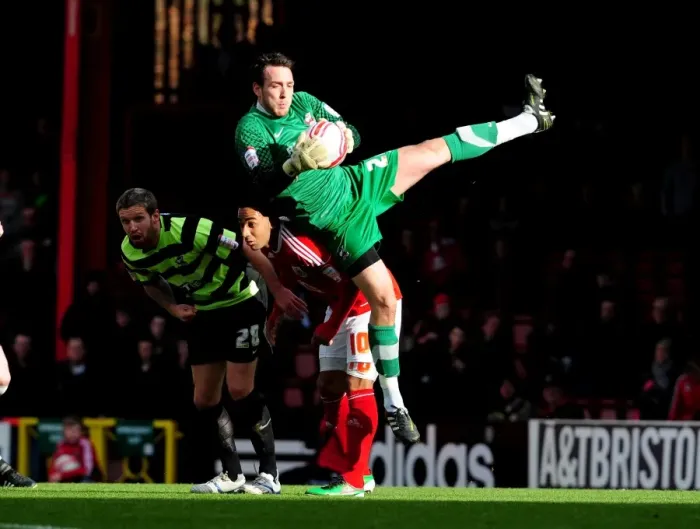Framed Print : Josh Lillis Claims the Ball: A Pivotal Moment in the 2010 Championship Match between Bristol City and Scunthorpe United
