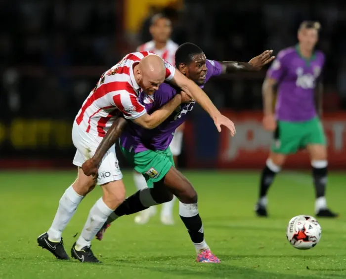 Framed Print : Jostling for Control: Taylor vs Emmanuel-Thomas in Cheltenham Town vs Bristol City Football Clash Framed Print : Jostling for Control: Taylor vs Emmanuel-Thomas in Cheltenham Town vs Bristol City Football Clash