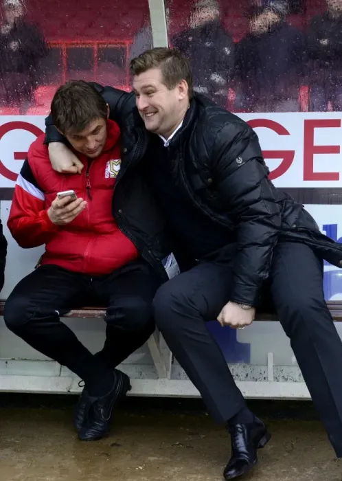 Framed Print : Karl Robinson Shares a Light-Hearted Moment with MK Dons Bench Before Bristol City Clash Framed Print : Karl Robinson Shares a Light-Hearted Moment with MK Dons Bench Before Bristol City Clash