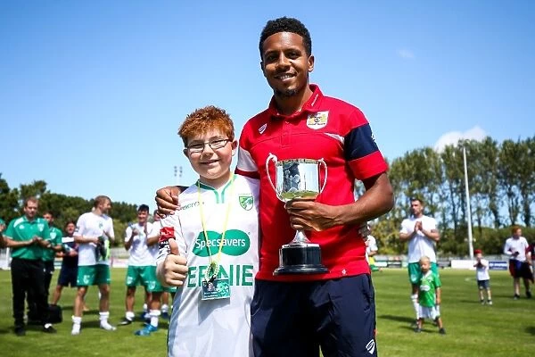 Korey Smith Receives Trophy after Guernsey's Defeat to Bristol City (0-1)