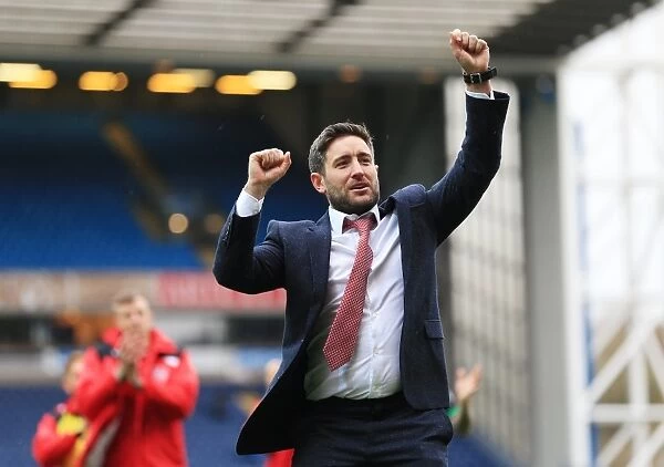 Lee Johnson's Euphoric Moment: Celebrating Promotion with Bristol City at Ewood Park