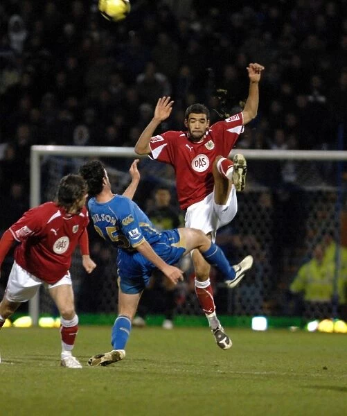 Liam Fontaine clears the ball ahead of Marc