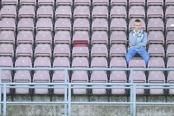 Lone Coventry Fan Amidst the Crowds of Sixfields Stadium during Coventry V Bristol City Match